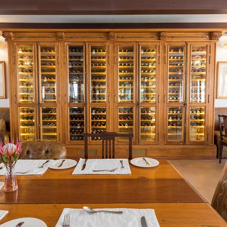 Drostdy Hotel Graaff-Reinet Exterior foto Wine rack at the restaurant